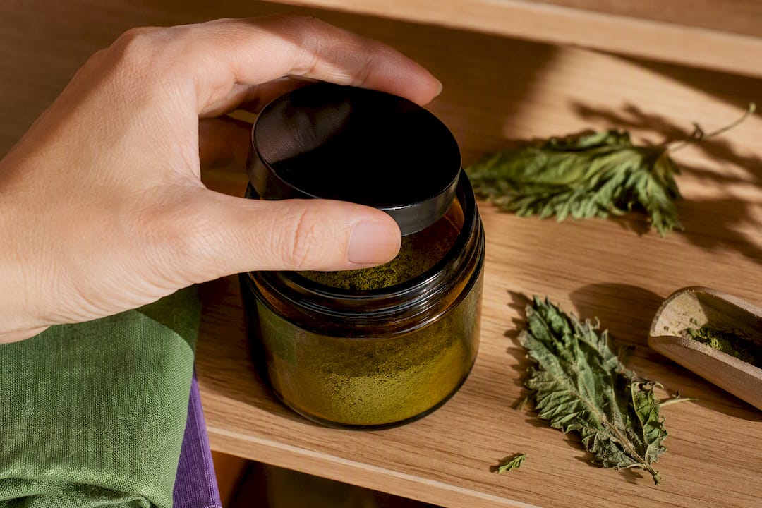 Nettle powder stored in an airtight jar