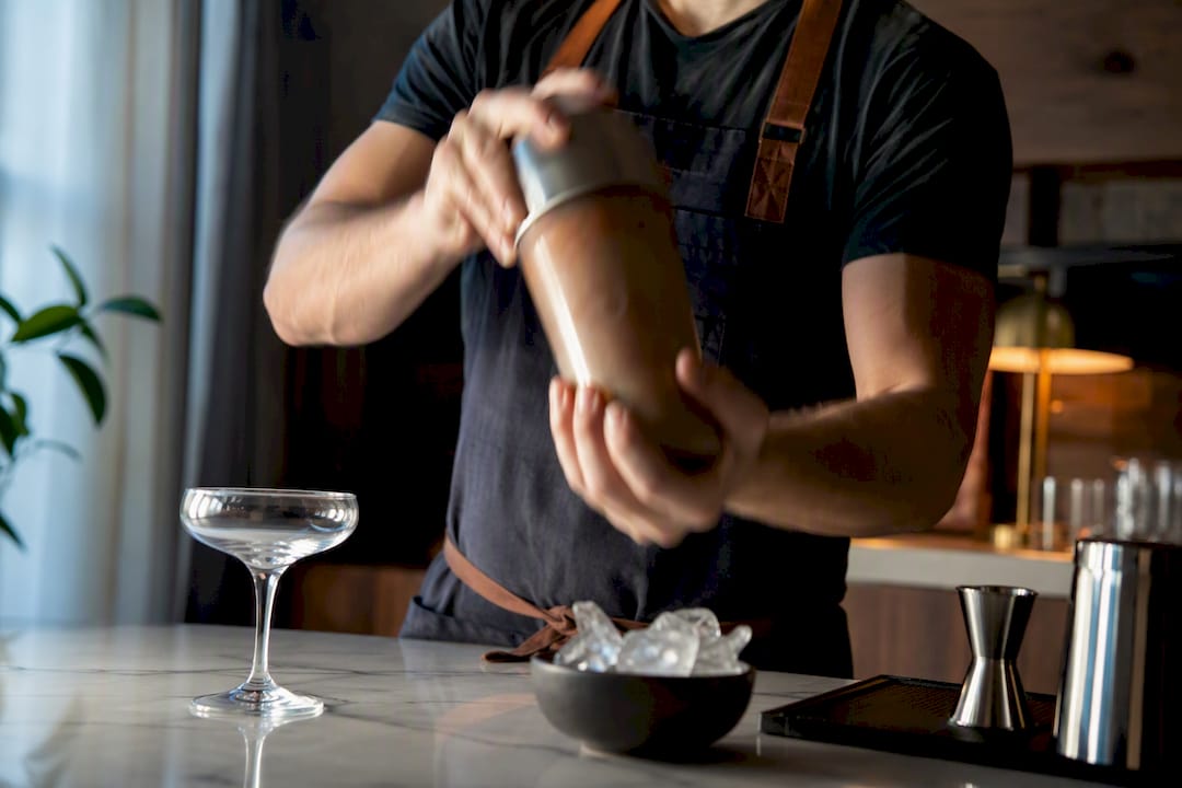 Hands dry shaking espresso mocktail mixture