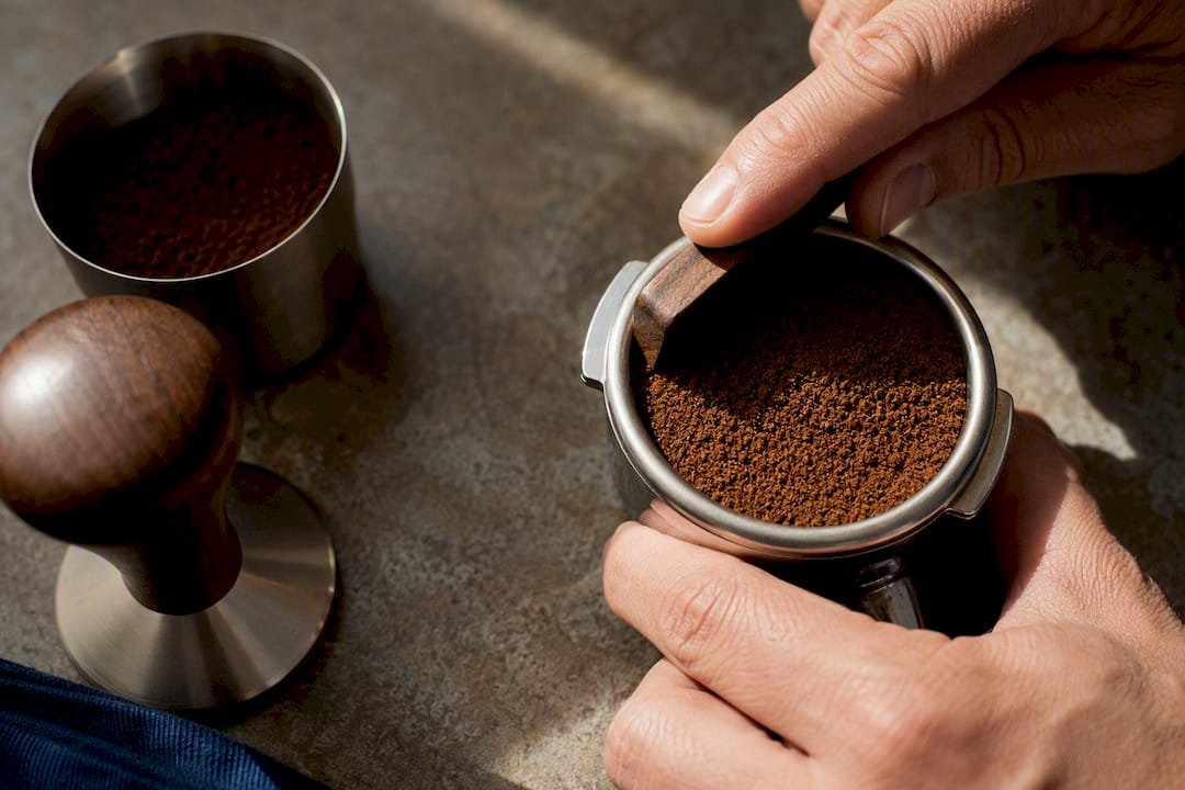 Fine espresso grounds prepared in a basket
