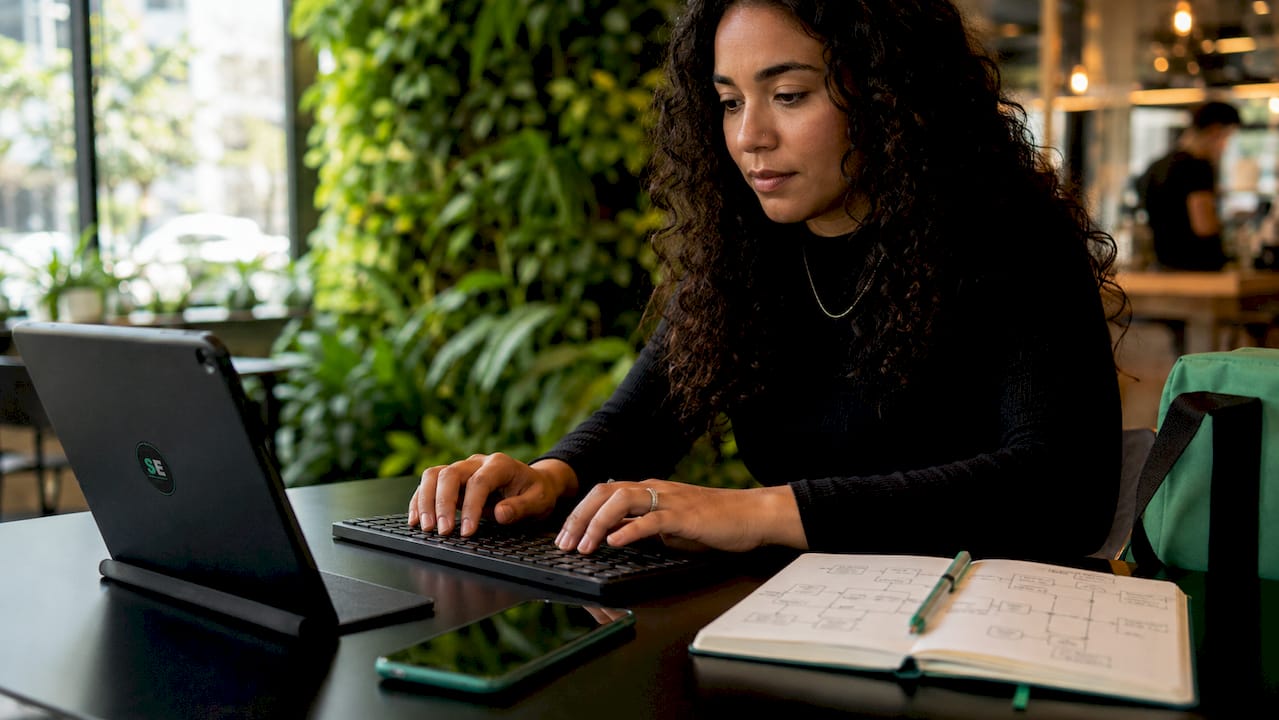 Hands typing to set communication triggers