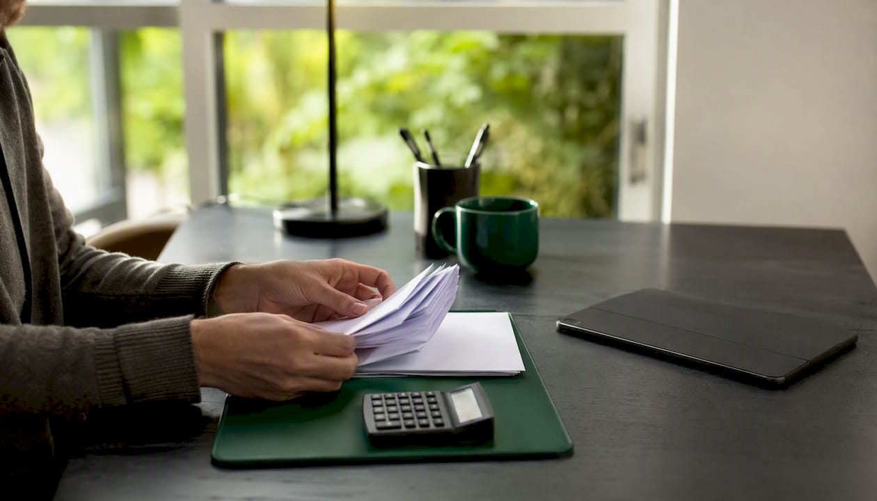 Hands arranging business diagnostic papers