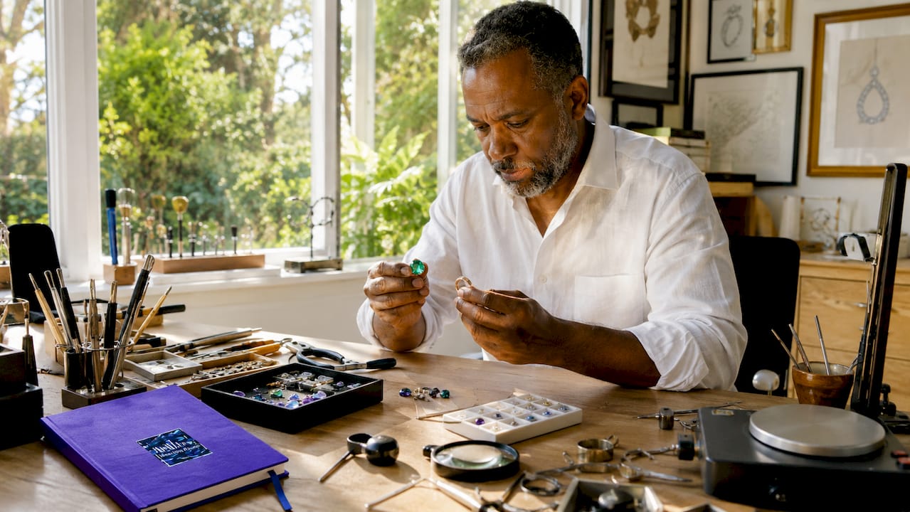 Customize Jewelry Gifts for Her: A Meaningful Guide Jeweler comparing gemstones and gold samples