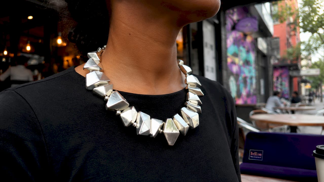 What Is Sculptural Jewelry? Styles, Trends, and Tips Close-up of sculptural necklace on model