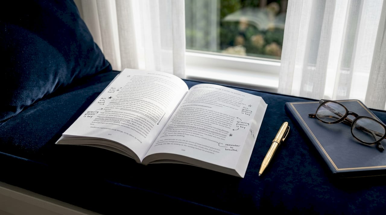 Open breakup book with handwritten notes