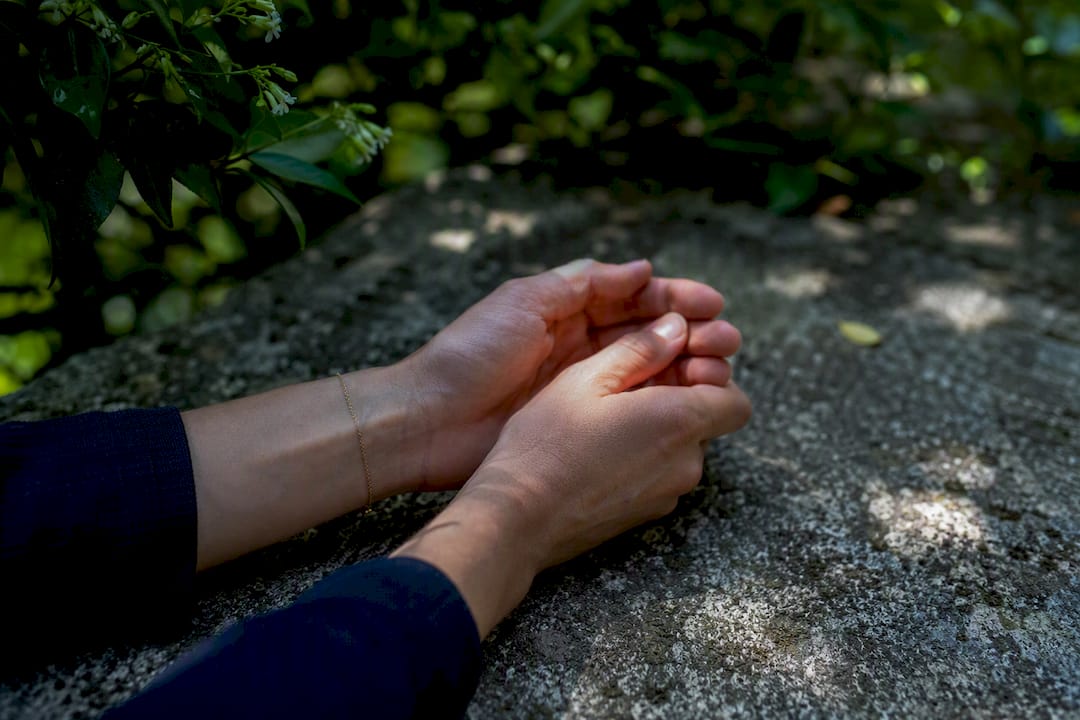 Hands practicing calming breath