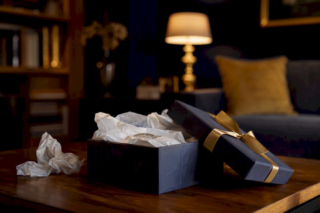 Unwrapped gift box suggesting emotional tension