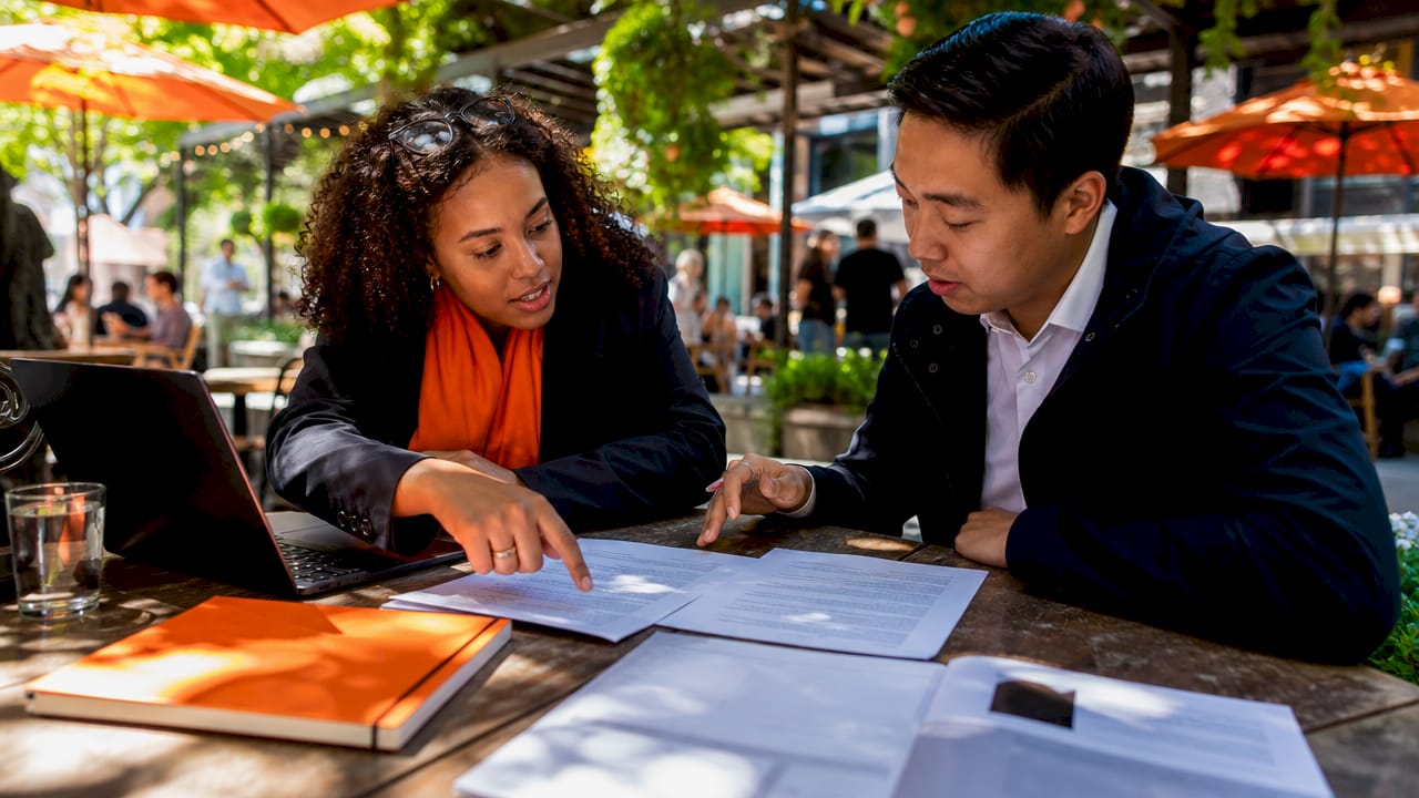Young professionals reviewing cover letter tone styles