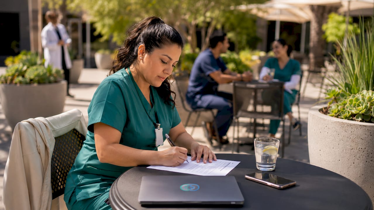 Healthcare worker completing tuition reimbursement form
