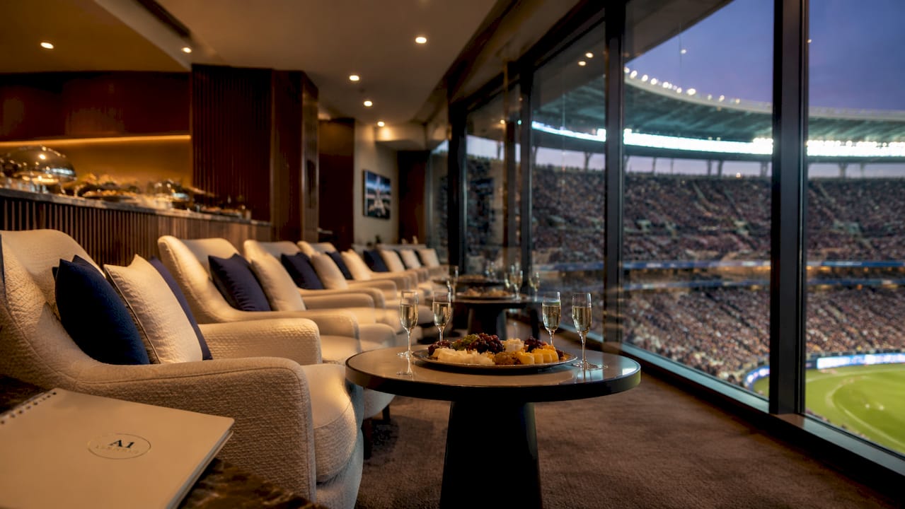 Empty premium stadium suite seating with stadium view
