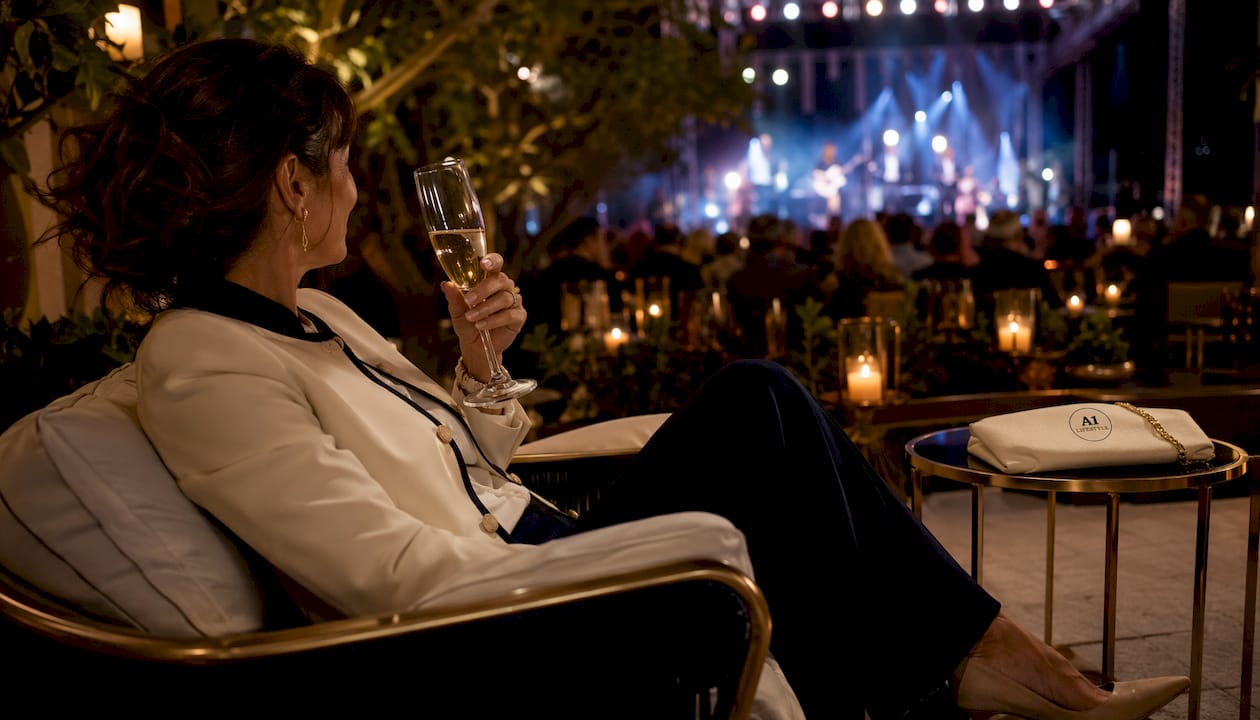 Person relaxing in VIP lounge at event