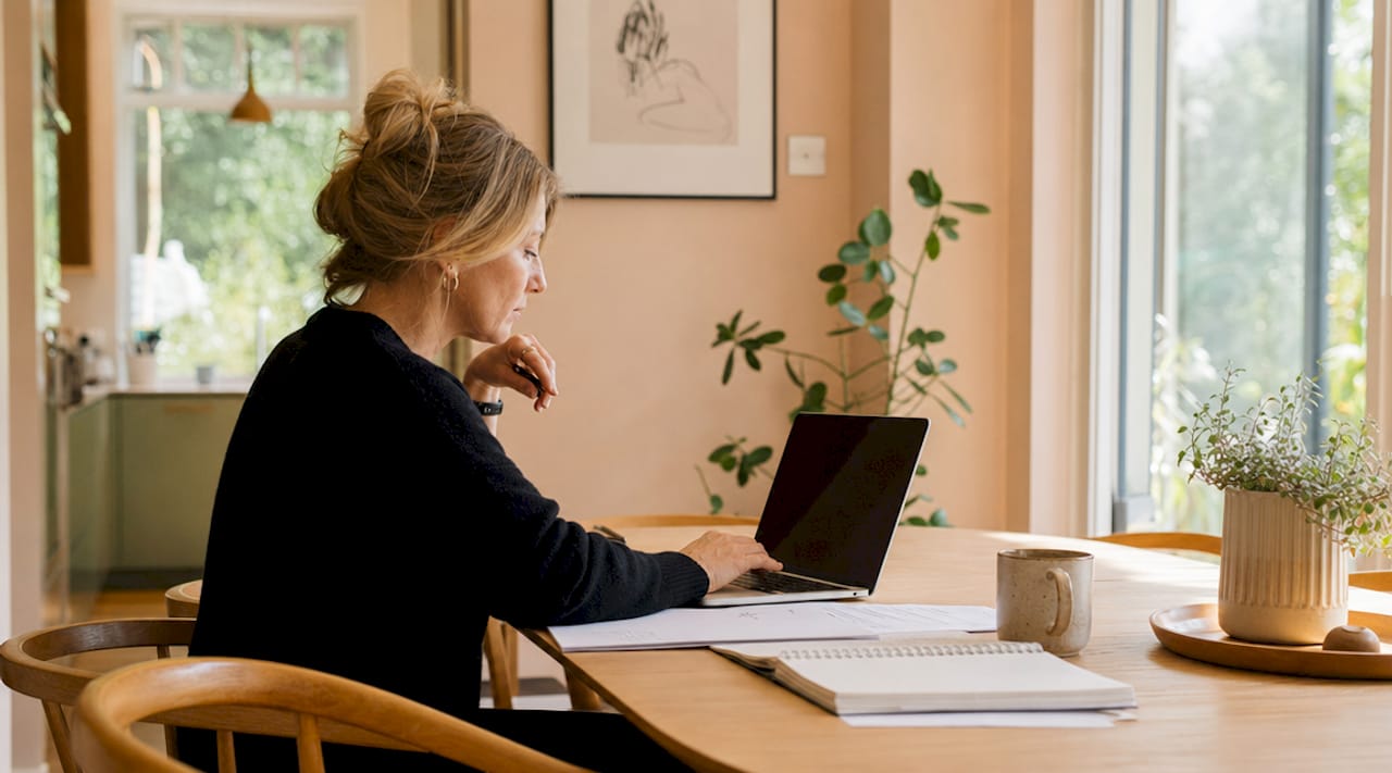 Woman planning website structure at home desk
