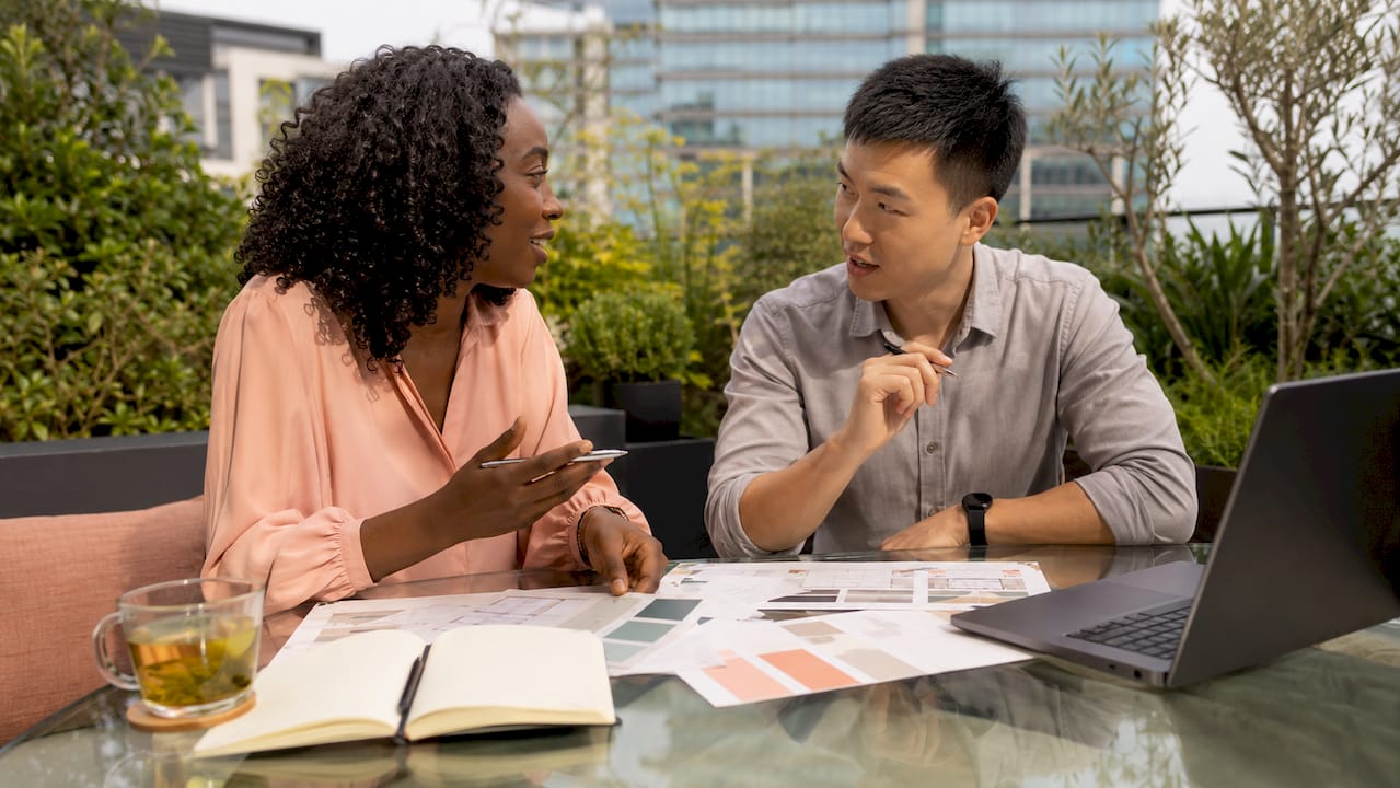 Collaborators reviewing website design elements