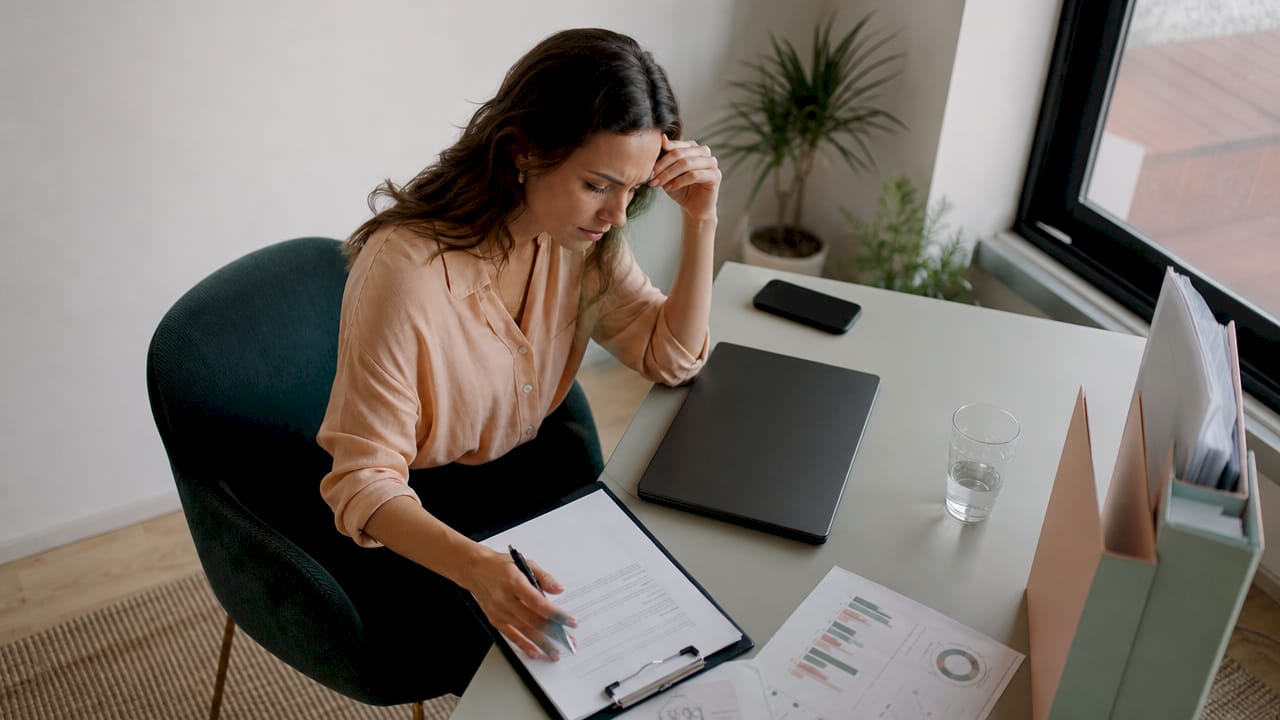 Professional woman reviewing enquiry drop-off notes