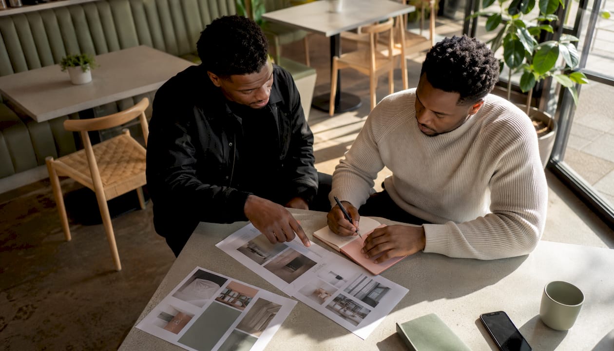 Two men discussing content campaign plans