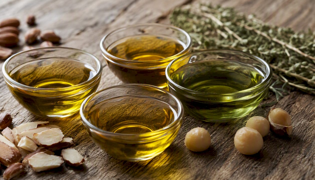 Close-up of different botanical oils in bowls