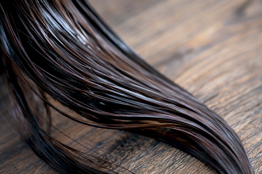 Close-up of oily hair strands texture