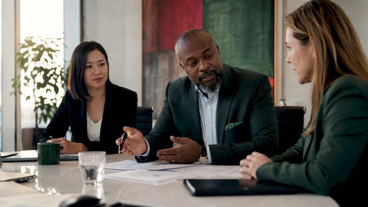 Board directors discussing corporate governance documents