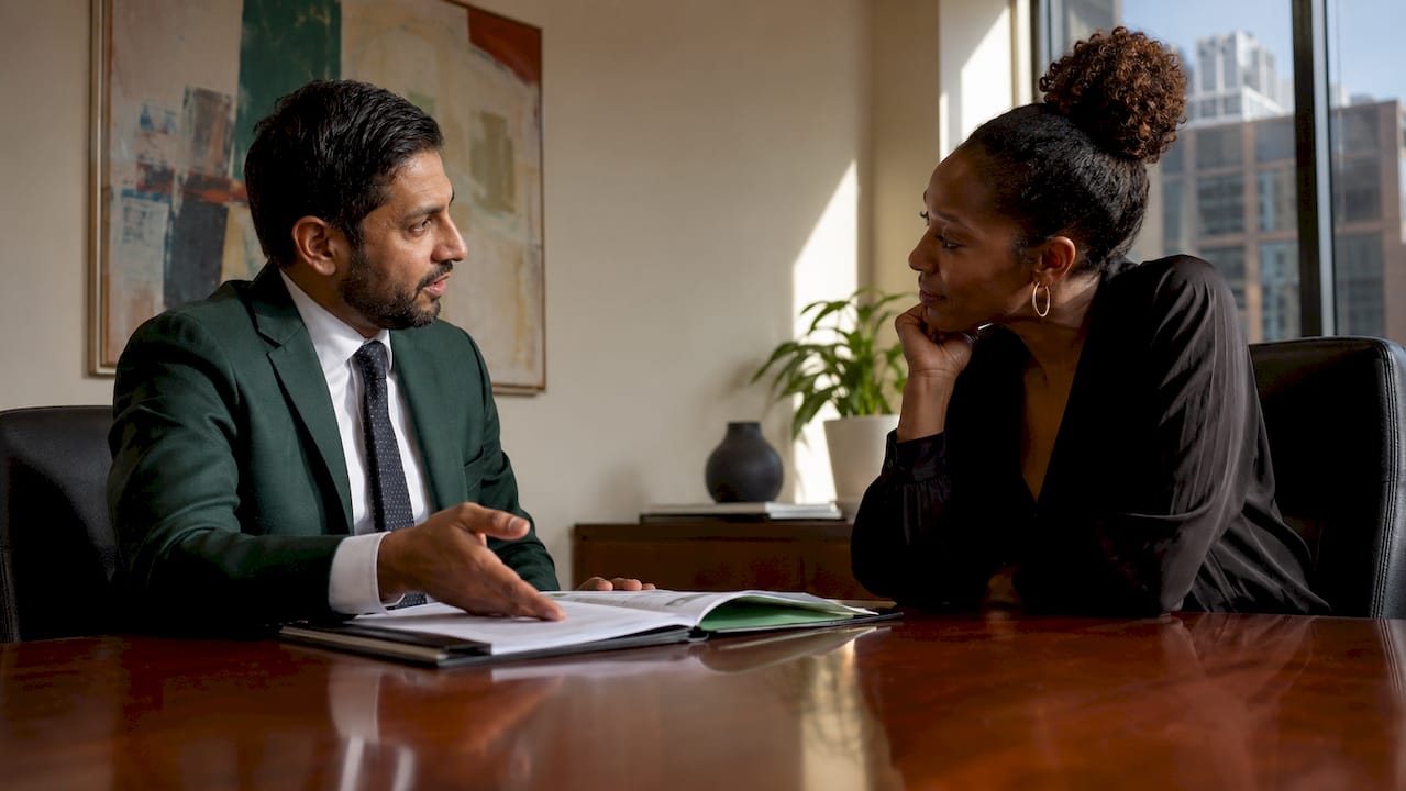 Lawyer and client discussing civil fraud case
