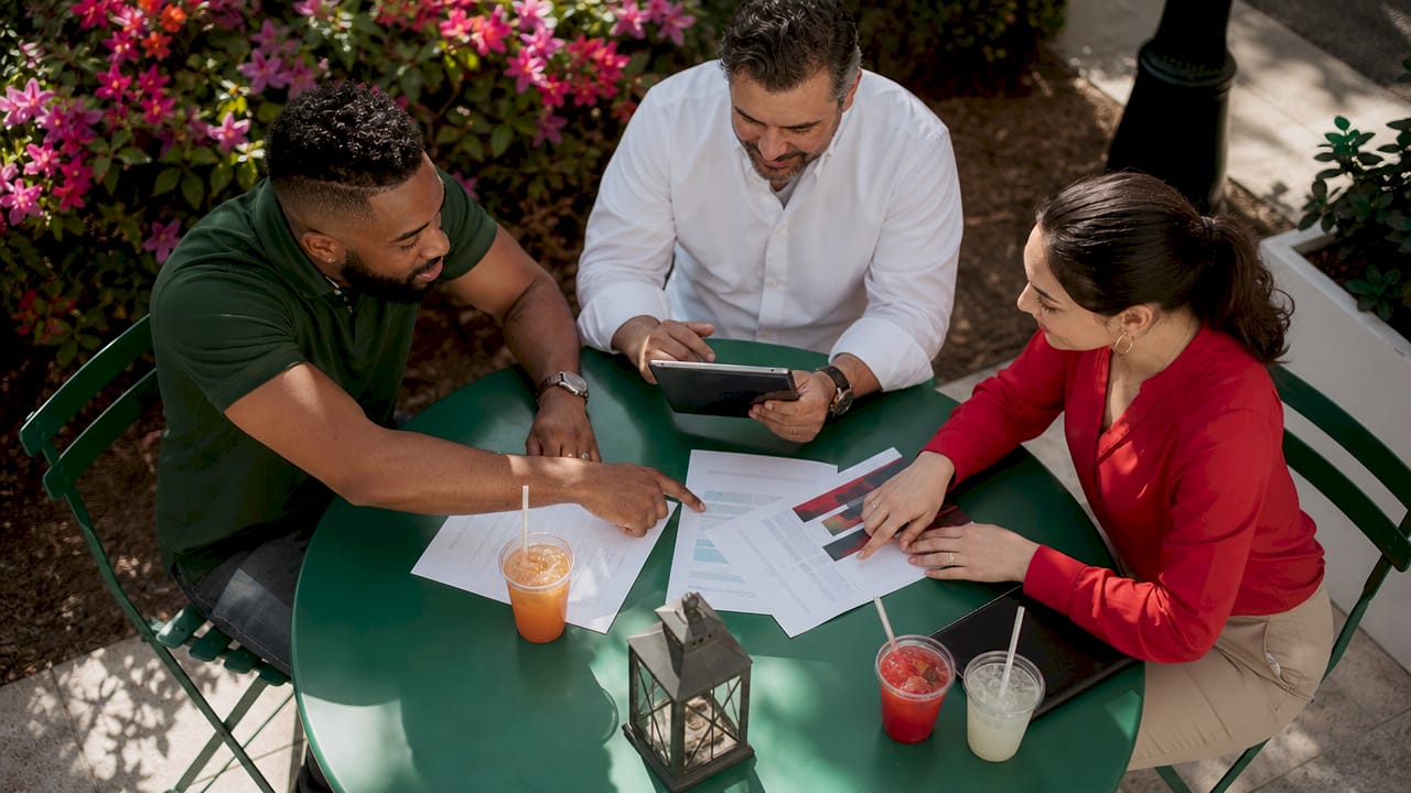 Group discussing business entity options outdoors