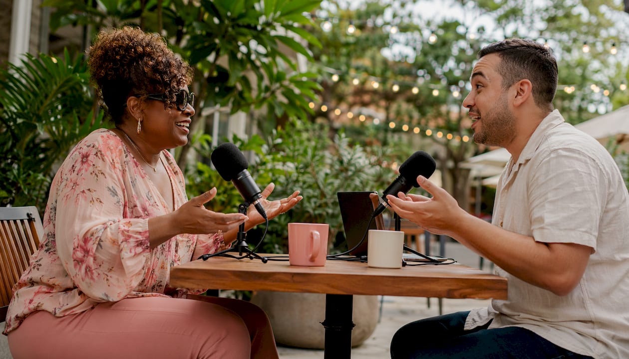 Podcast hosts recording twin parenting episode