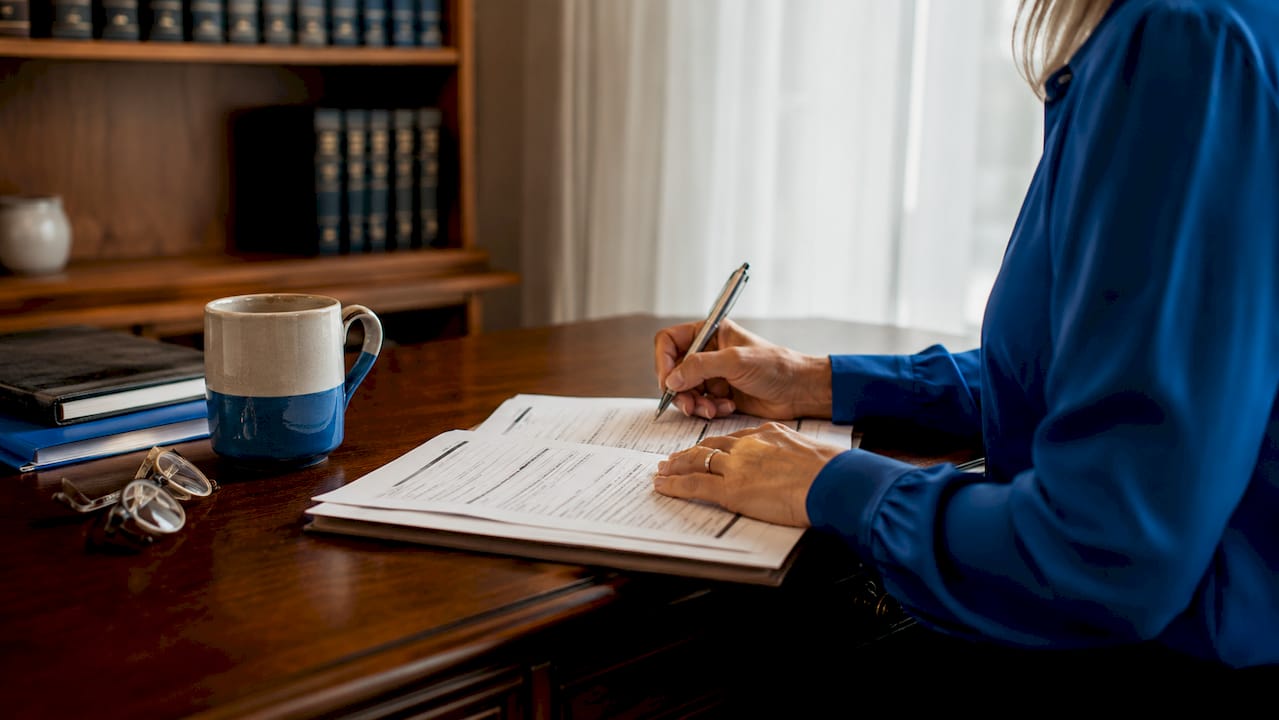 Trustee hands annotating nomination papers