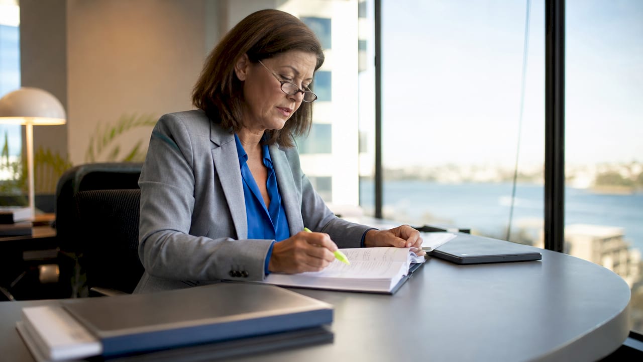 Solicitor reviewing business will in meeting room