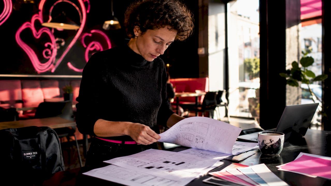 UX designer reviewing wireframes