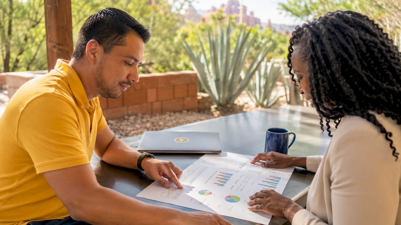 Hands pointing at Sedona spring rental charts