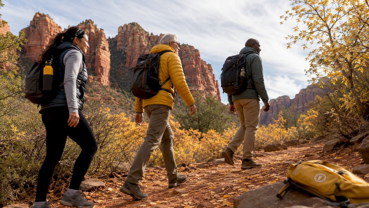 Hikers exploring Sedona red rock trails in spring