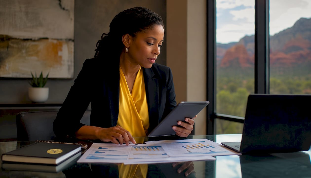 Hotel revenue manager reviewing performance metrics infographic