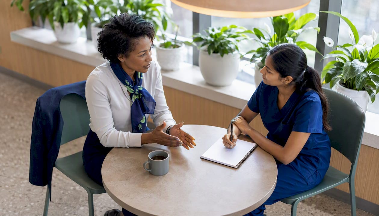 Experienced nurse mentoring new grad nurse