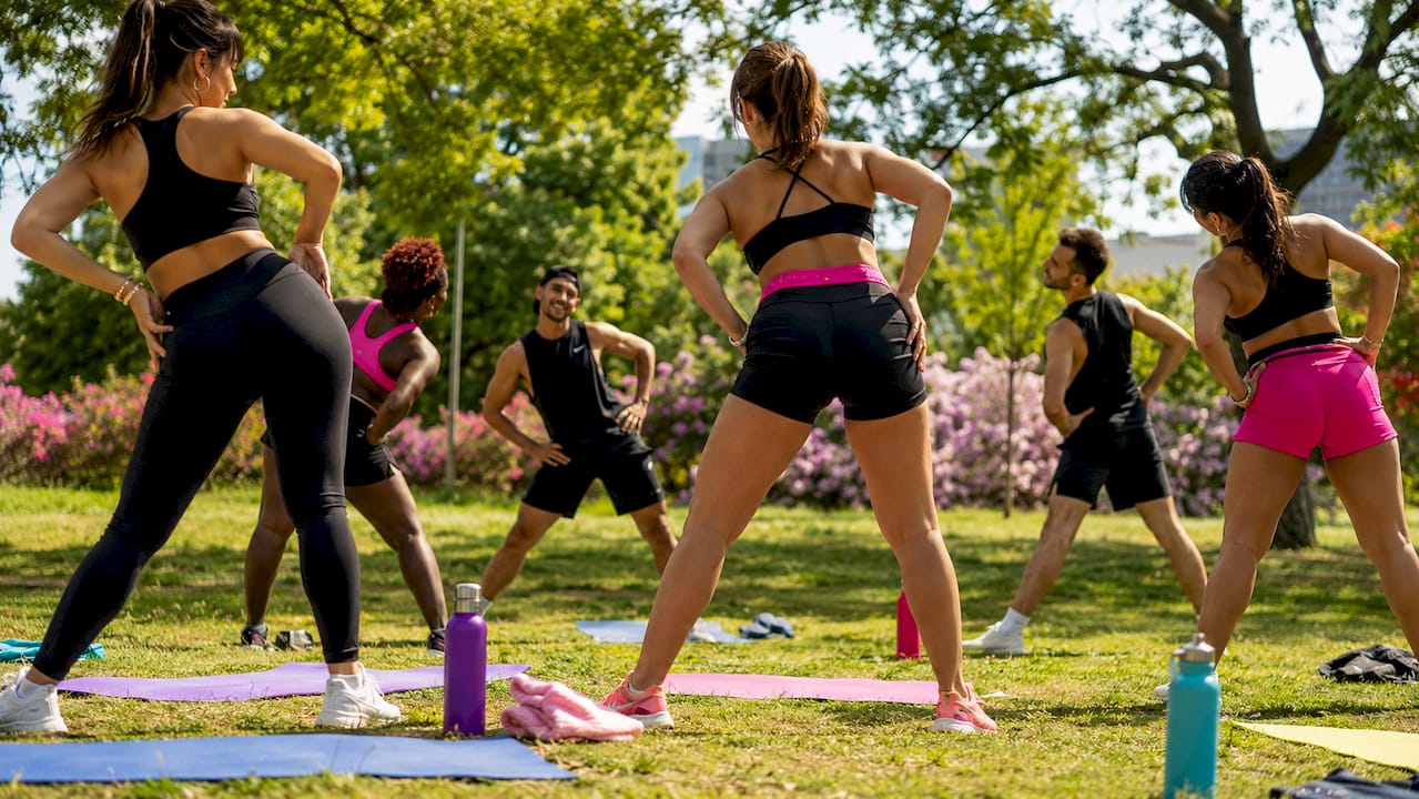 Diverse group doing dance warm-up stretches
