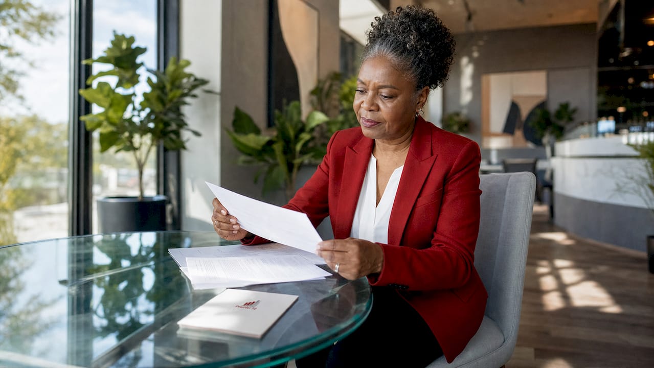 Business owner reviewing insurance plans in office