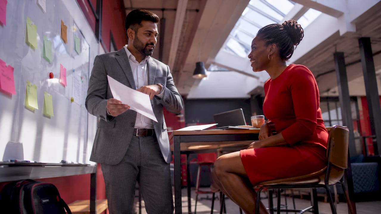 Executives discussing brand advertising campaign