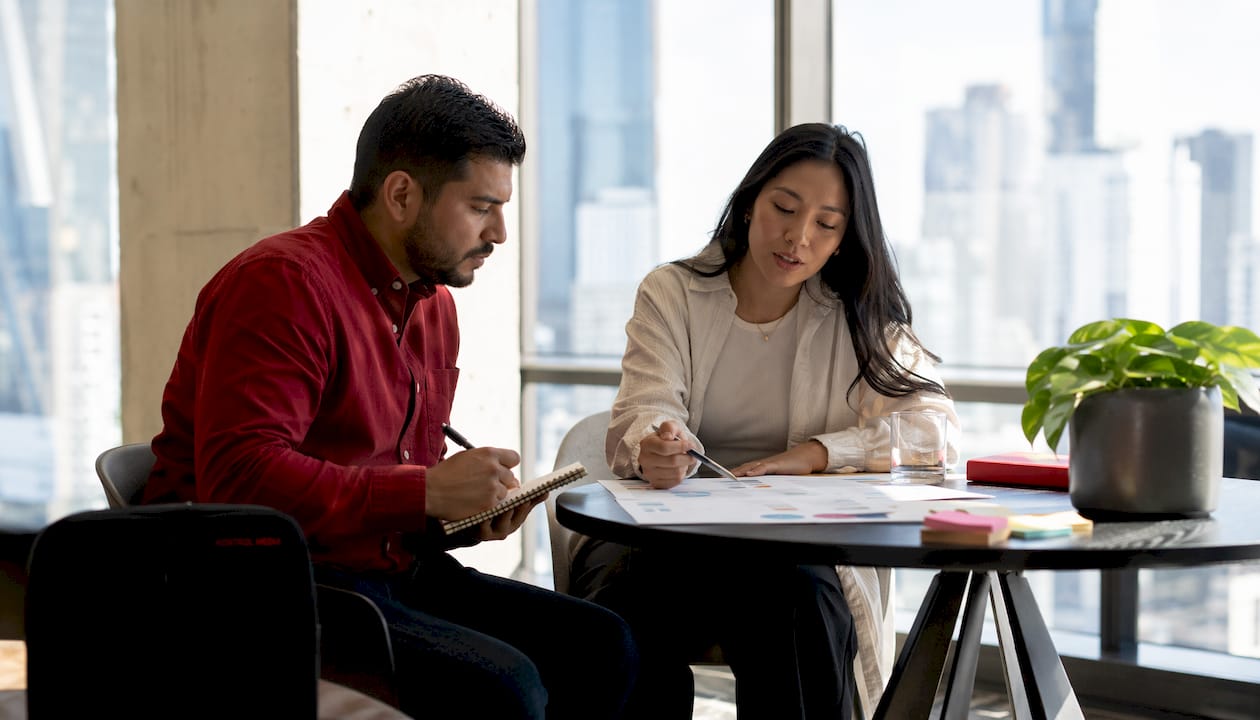 Professionals discussing revenue strategies in meeting