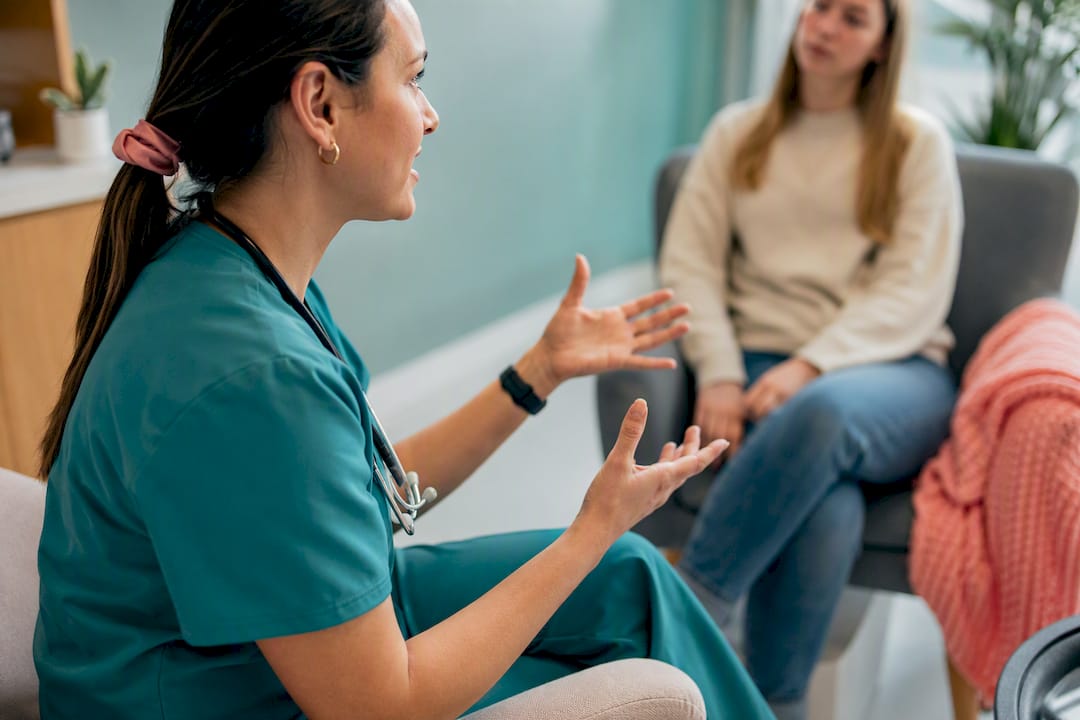 Nurse measuring patient blood pressure bedside