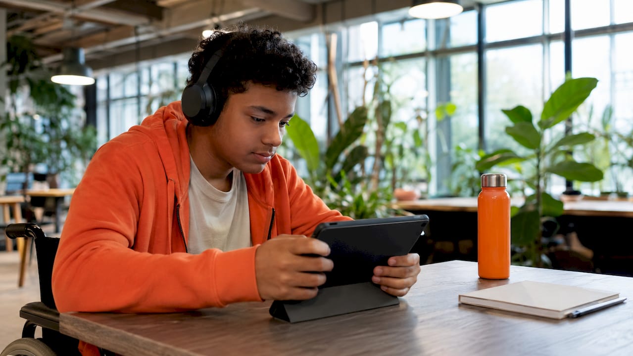 Student using computer accommodation in study room