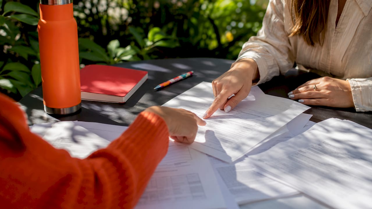 Hands reviewing MCAT accommodation application documents