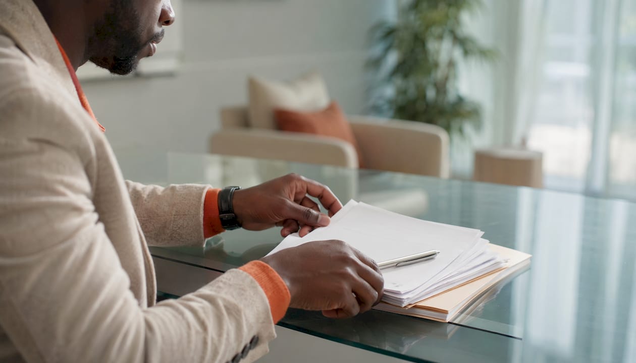 Psychologist organizing medical documentation on desk