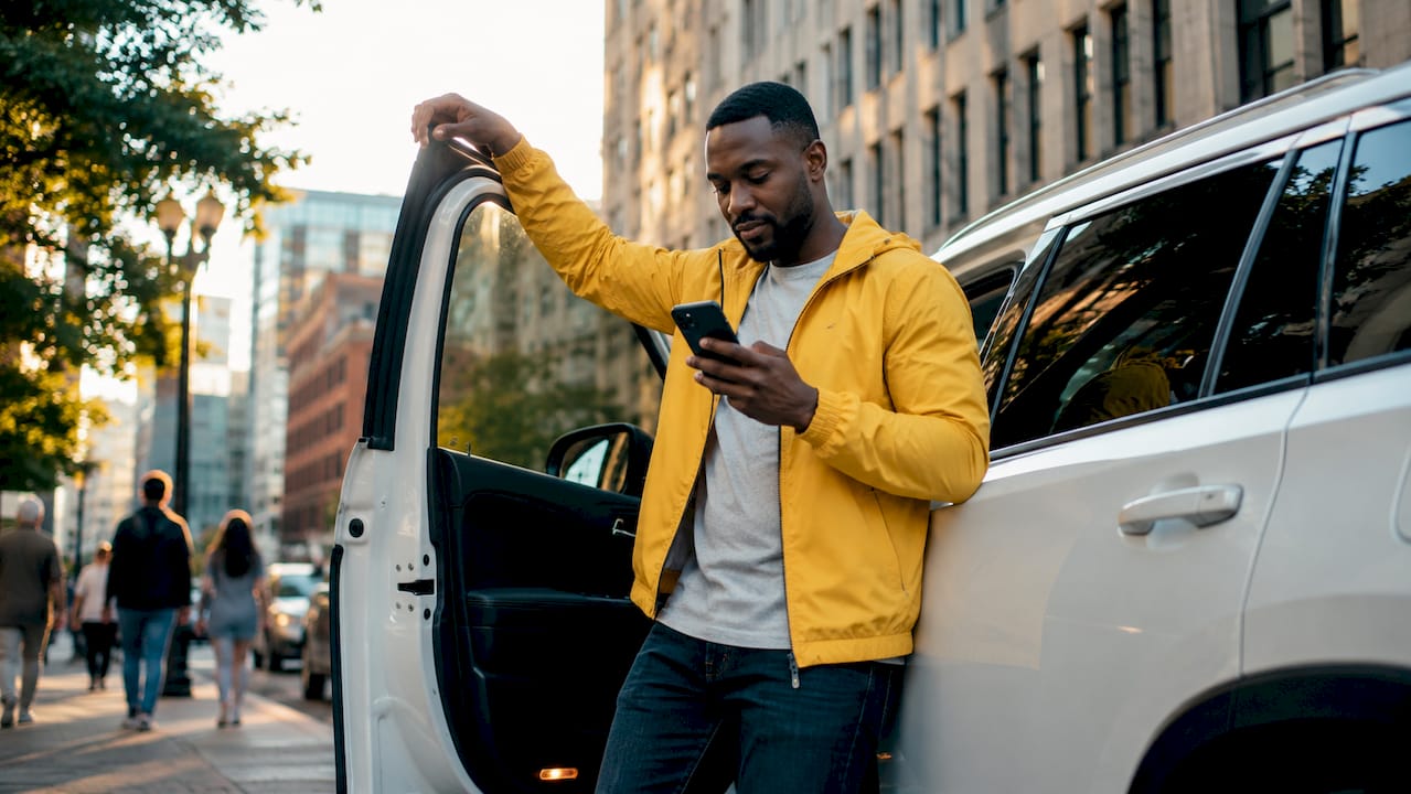 Car owner scheduling repair appointment on phone