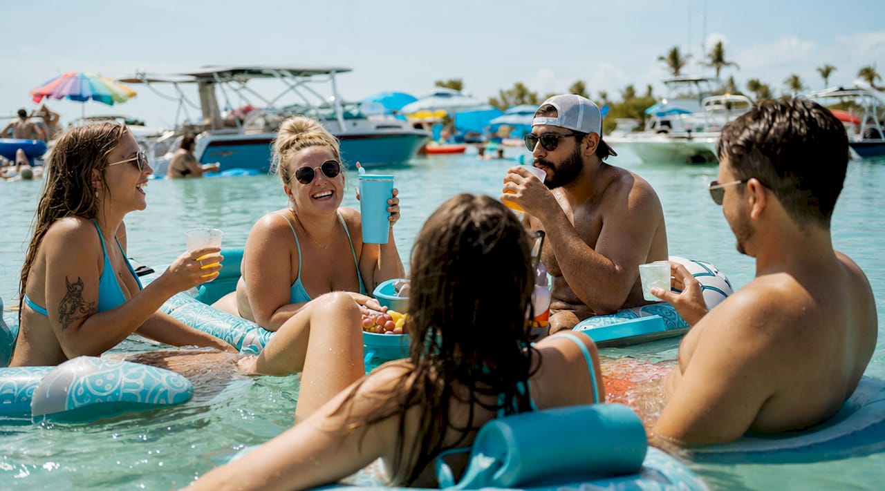 Lively floating party on Crab Island shallow waters
