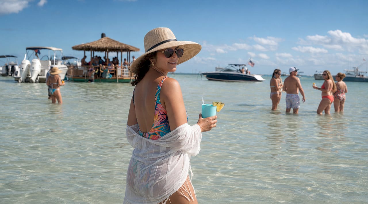 Woman enjoying floating bar scene in shallow water