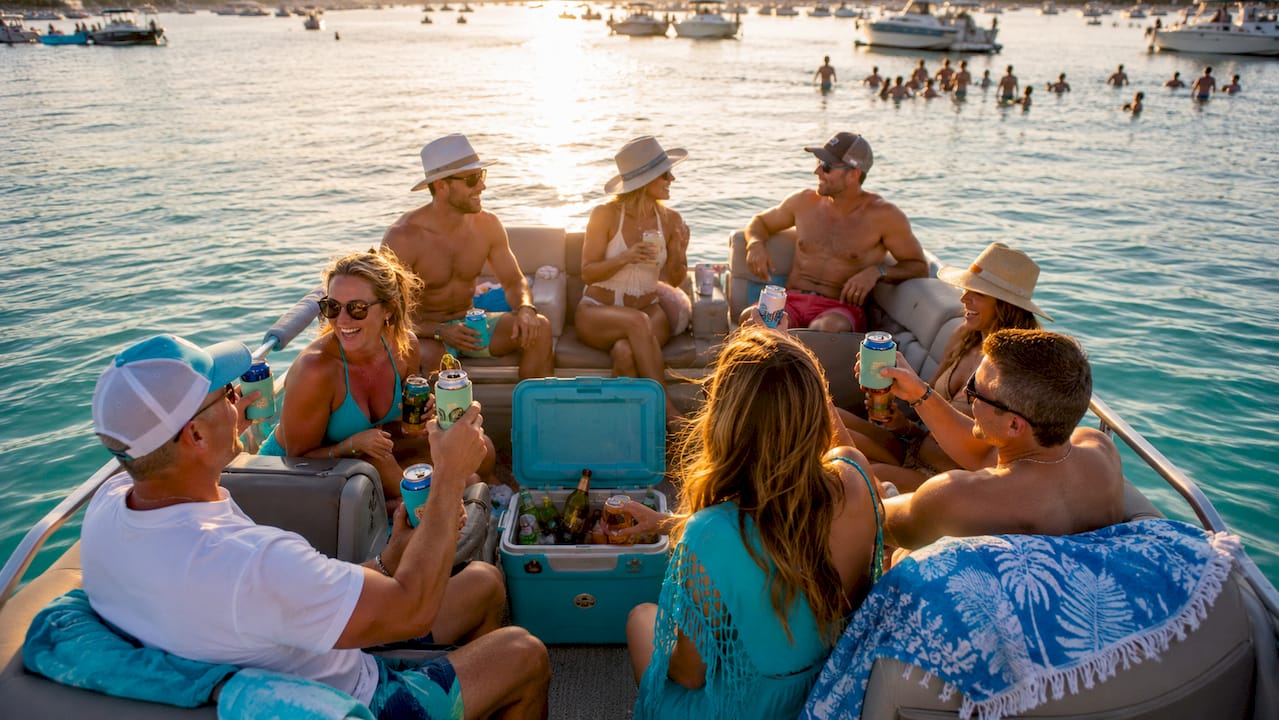 Group relaxing on pontoon boat near Crab Island