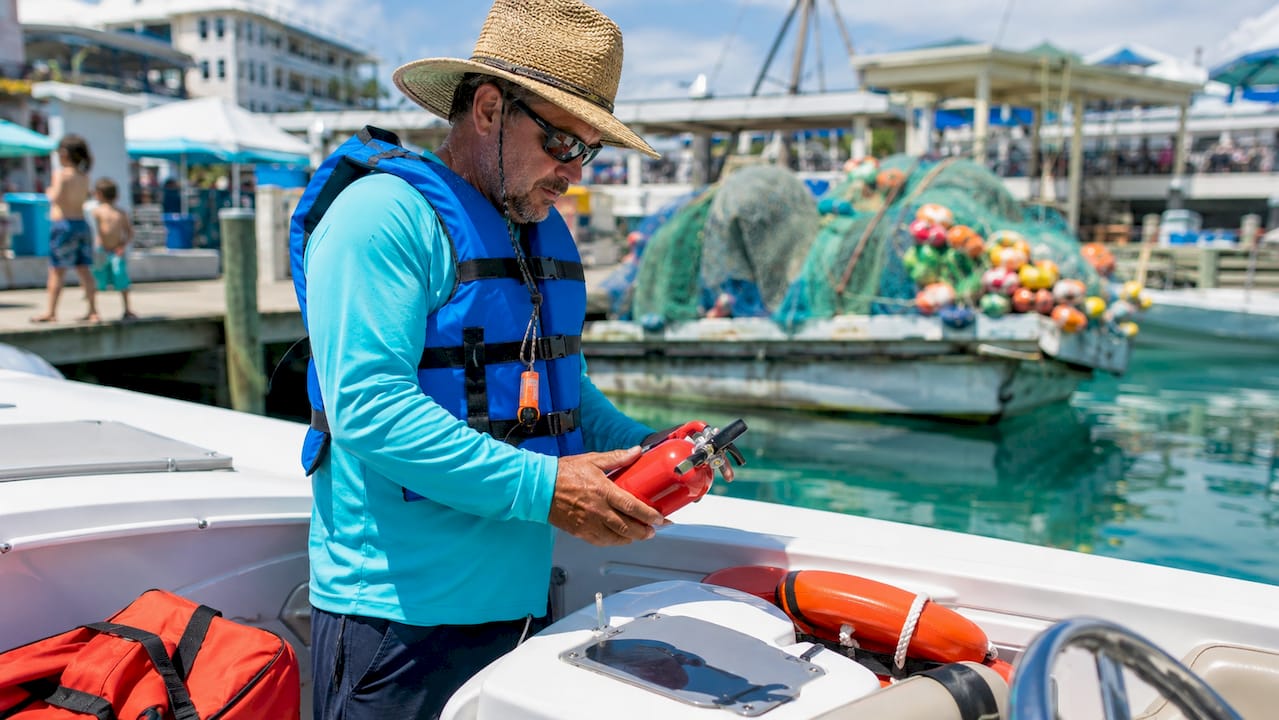 Man preparing motorboat for safe boating in Destin