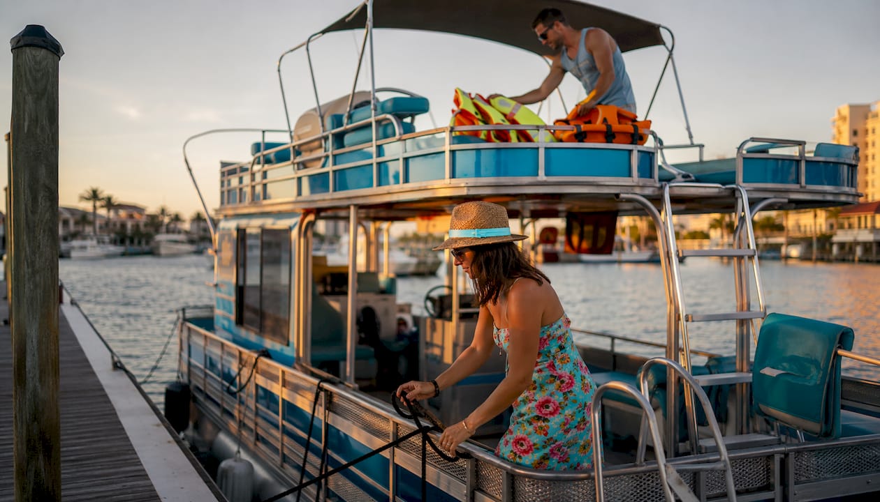 Couple ready to board pontoon boat at Destin dock