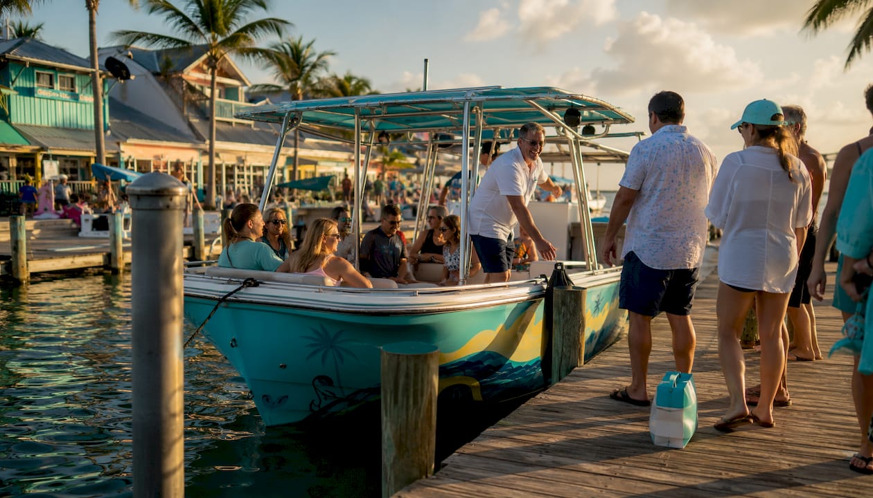 Excursion boat boarding passengers at marina