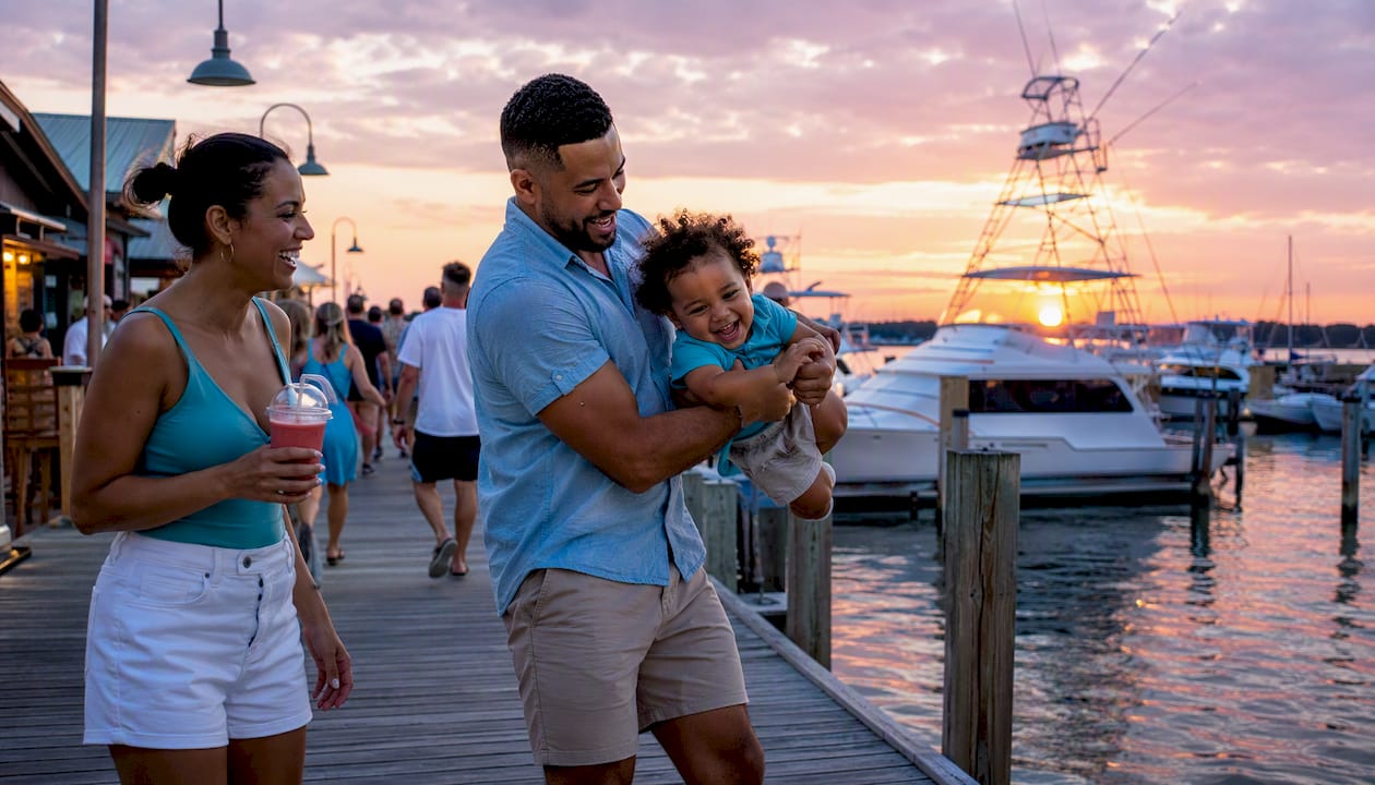 Young family strolling on Destin Harbor Boardwalk