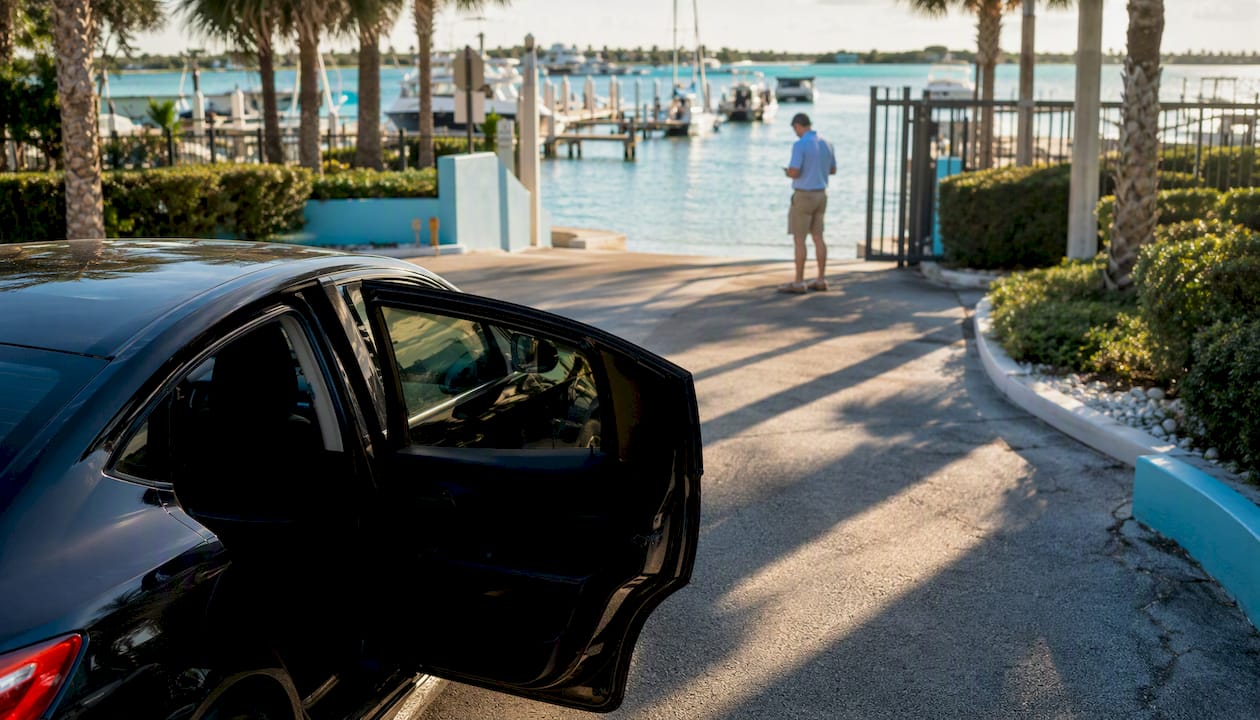 Ride-share car arriving at marina entrance