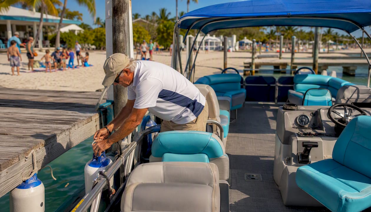 Captain preparing tour boat safety equipment