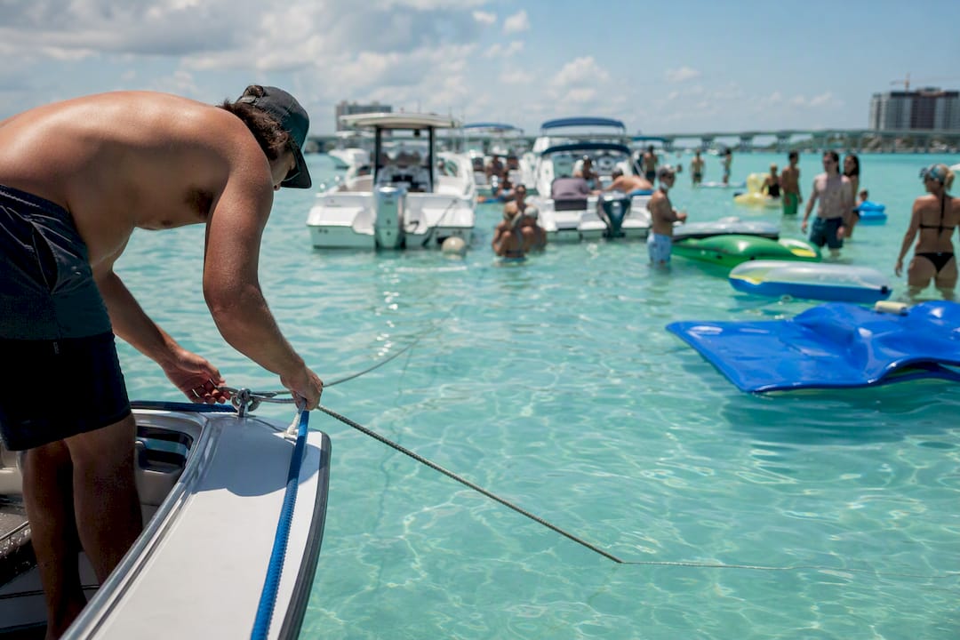 Families enjoying shallow water at Crab Island sandbar